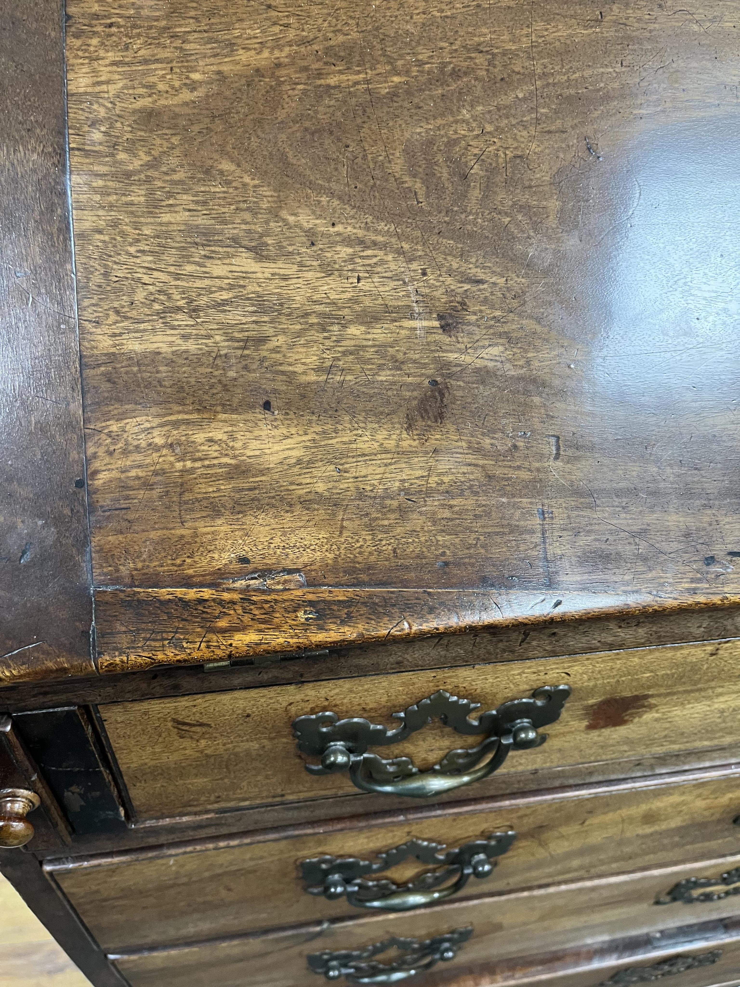 A small George III mahogany bureau cabinet with broken arch pediment, width 95cm, depth 62cm, height 198cm